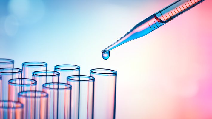 PFAS testing with a pipette dropping liquid into test tubes on a blue and pink gradient background.