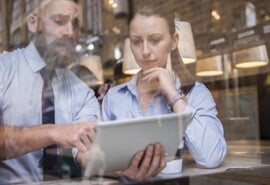 Two professionals assessing their supply chain sustainability program.