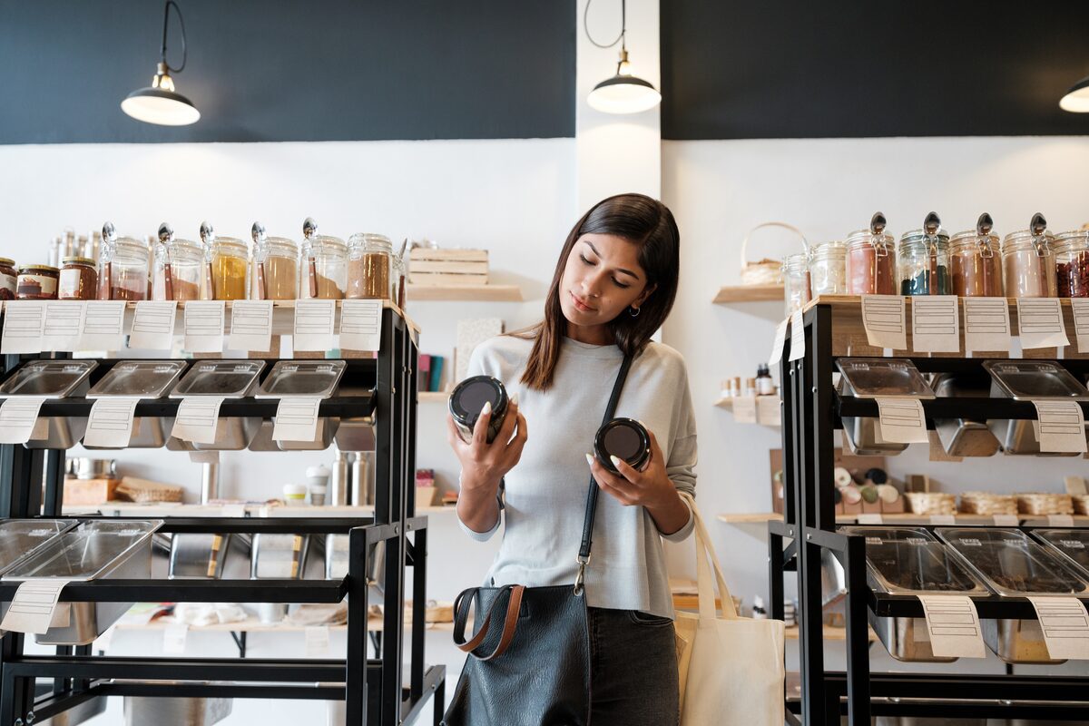 female comparing product labels